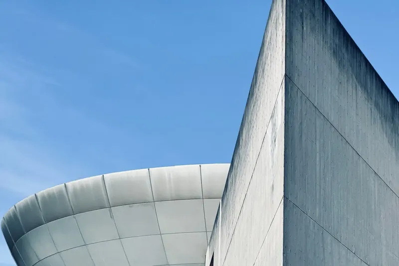 Futuristic concrete architecture against a blue sky